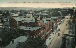 West Fourth St Looking east from Pine St Showing Brandon Hills in rear. Postcard