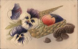 A basket filled with flowers, fruit, and some nuts on the side Postcard