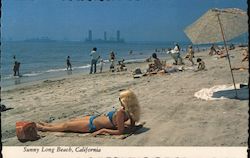 Woman Sunbathing on Beach Postcard