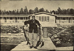 Fisherman with two Large Fish