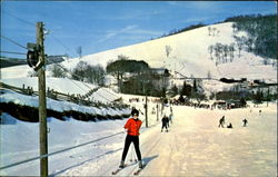 Riding The Ski Tow To The Top Of The Slope