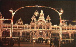 Crowd at Night with many little lights on building