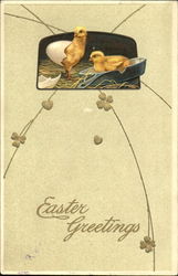 Two chicks, one hatching from an egg and the other sitting in a frying pan