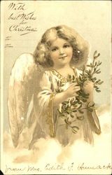 Little blonde angel girl holding green holly