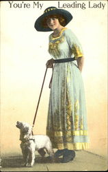 Lady in hat with dog on leash