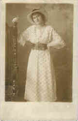 Woman with white hat and dress
