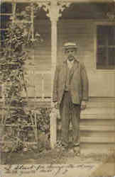 Man in front of House
