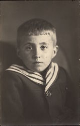 Young Boy with a Striped Collar Young Boy with a Striped Collar