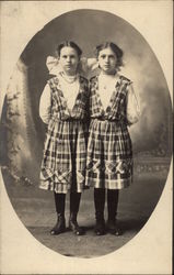 Portrait of Two Girls in Matching Dresses Portrait of Two Girls in Matching Dresses