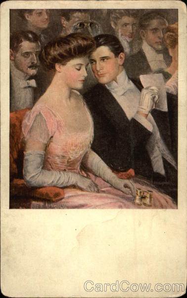 Man and Woman in Evening Attire Whisper During Theater Performance