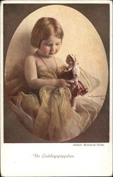Little Girl Playing with her Doll Little Girl Playing with her Doll