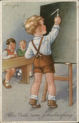 Boy Writing on Chalkboard in School Room Boy Writing on Chalkboard in School Room