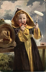 Blond Boy wearing Gold & Black Robes eating a Pretzel and Beer Blond Boy wearing Gold & Black Robes eating a Pretzel and Beer