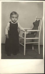 Vintage Photograph of Young Boy standing beside Chair with Teddy Bear Vintage Photograph of Young Boy standing beside Chair with Teddy Bear
