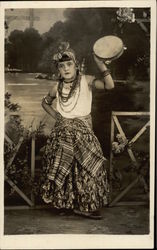 Girl wearing Gypsy Costume holding Tambourine Girl wearing Gypsy Costume holding Tambourine
