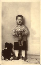 Little Boy in Knickers holding Teddy Bear Little Boy in Knickers holding Teddy Bear