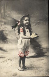 Photograph of Young Barefoot Brunette Girl holding Flowers Photograph of Young Barefoot Brunette Girl holding Flowers
