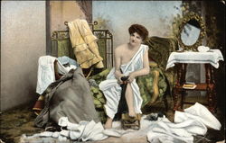 Woman Sitting on Chaise Putting on Stockings Woman Sitting on Chaise Putting on Stockings