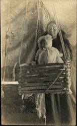 Native American Woman with Baby in a Cradle Native American Woman with Baby in a Cradle