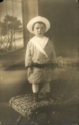 Young Child Standing on a Chair Young Child Standing on a Chair