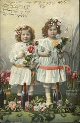 Two Girls Holding Flowers Two Girls Holding Flowers