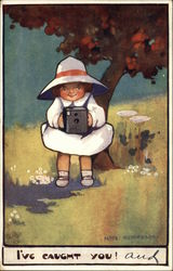 Little Girl Holding a Camera and Taking a Photograph Little Girl Holding a Camera and Taking a Photograph