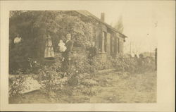 Man with Baby, People, Outside Ivy Covered Bungalow Man with Baby, People, Outside Ivy Covered Bungalow