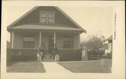 Family Posing Outside Bungalow Family Posing Outside Bungalow