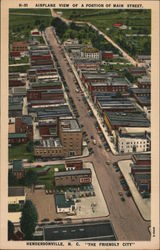 Airplane view of a portion of Main Street. Hendersonville, N.C. "The Friendly City" Postcard