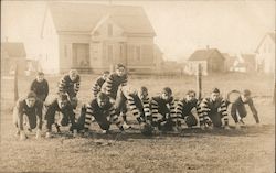 Football Team Kneeling in Field Postcard