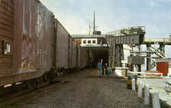 Loading boxcars on the boats of the Port Marquette line Postcard