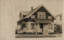 houses in suburbs, with children playing on front lawn. 1908. Postcard