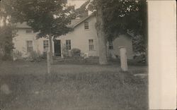 Wooden House with Grassy Yard and Trees Postcard