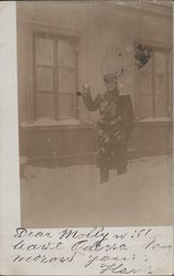 Man Holding Snowball In Front Of A Building Postcard