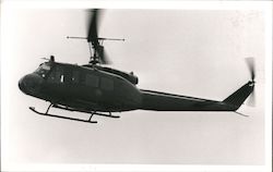 Dark Helicopter Flying In The Sky Postcard