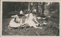 Women beating a boy with a stick by a river Postcard