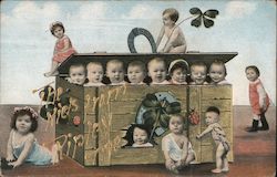 Multiple Babies in and around a box Postcard