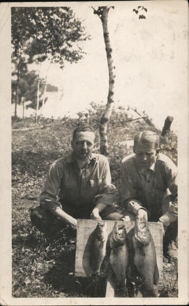 Woman Lake - Men showing off fish they caught Hackensack Minnesota