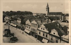 Czech market street with fountain and large cathedral in background Postcard