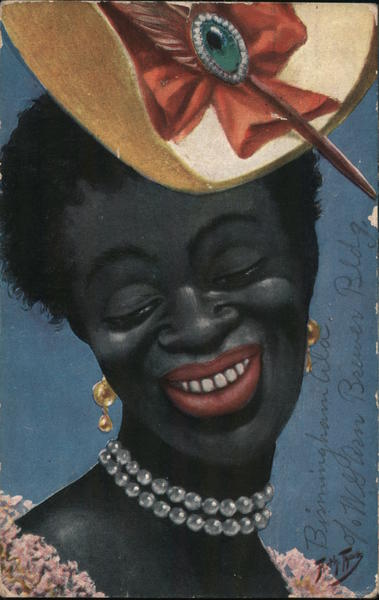 Headshot of black women with short hair, smiling, wearing a pearl necklace, large hat