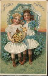 Easter Greetings - Two girls in white dresses are holding a basket of baby chickens under an umbrella Postcard