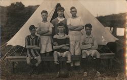 Football Soccer Team on Bench in Front of Tent Postcard