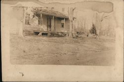 Unidentified House with covered front porch and trees in yard Postcard