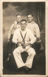 US Navy Sailor & 2 other men, Studio Photo F.J. Dornan, Photographer Postcard Postcard Postcard