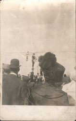 Woman gymnast stand on man's head, crowd watched acrobatic performers Postcard