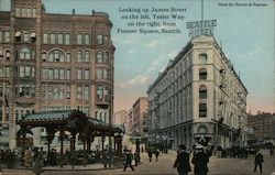 Looking up James Street on the left, Yesler Way on the right, from Pioneer Square. Postcard