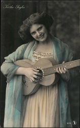 Kathe Loyles Plays a Guitar Postcard