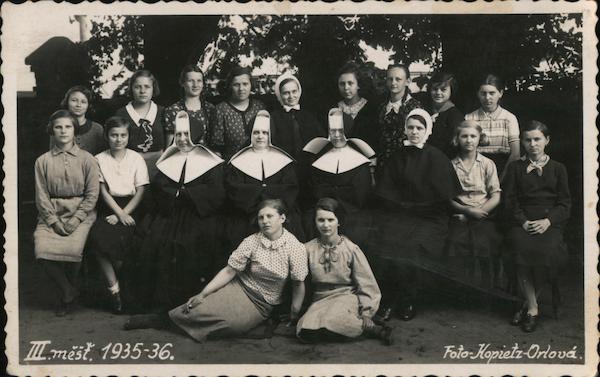 Group photo of young women seated around 3 nuns in habits, 1935-36, Foto kopietz-orlova Czechoslovakia
