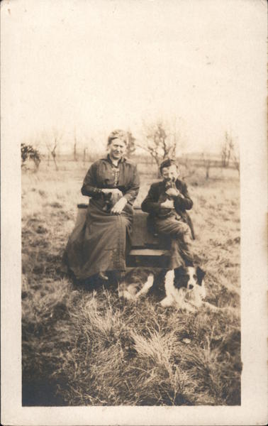 Woman and Boy with Dogs