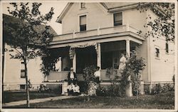 Family Sitting on Porch of House 1909 Postcard